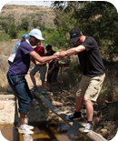 Helping each other to cross bridges. Helping each other to cross bridges.